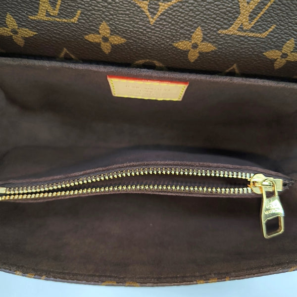 MÉTIS EAST WEST Monogram Coated Canvas Brown
