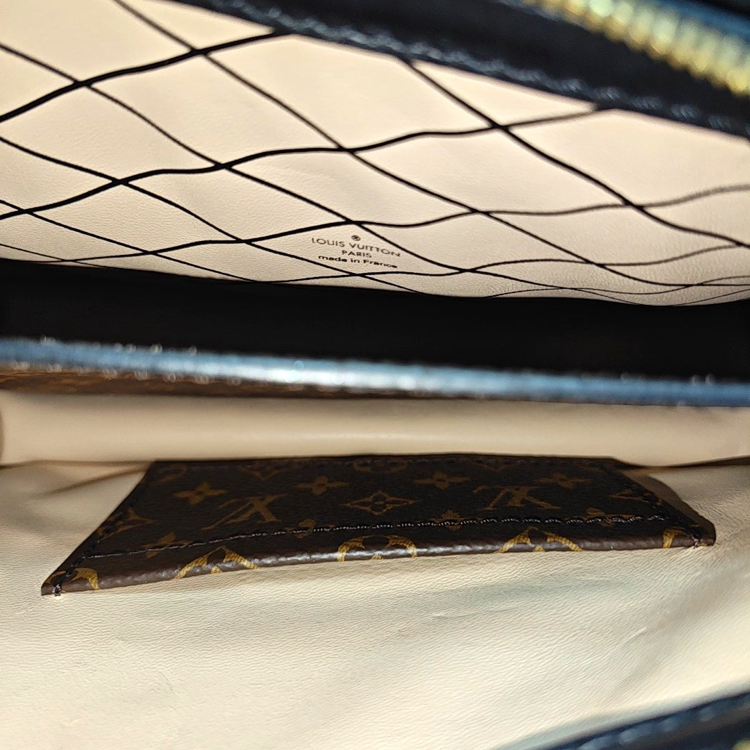 TRUNK Monogram Coated Canvas Brown