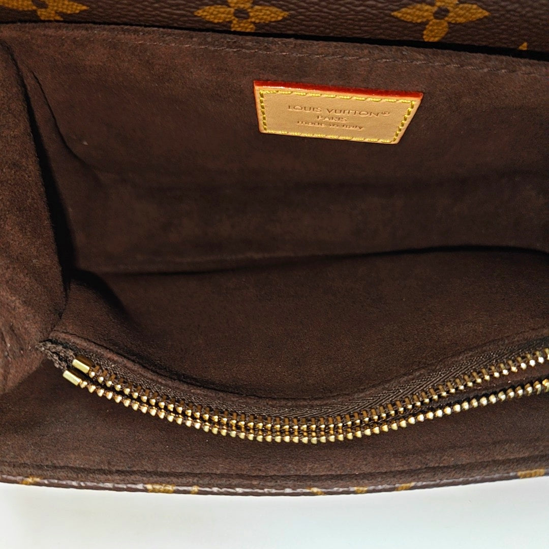 MÉTIS EAST WEST Monogram Coated Canvas Brown