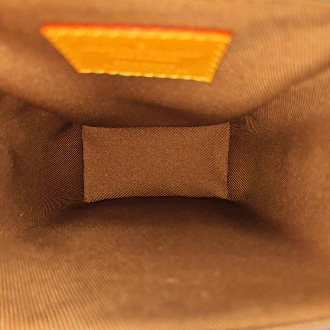 TRUNK Monogram Coated Canvas Brown