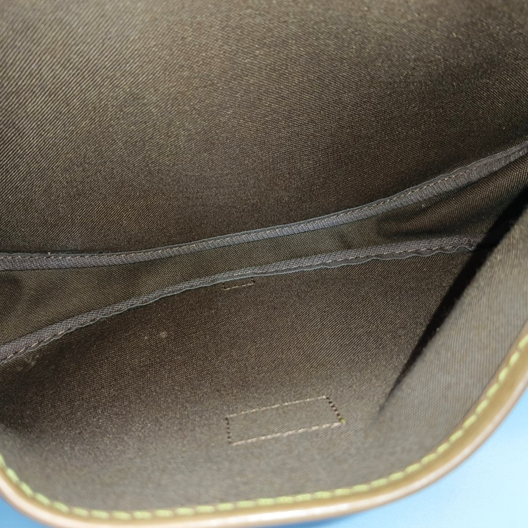 SAUMUR Monogram Coated Canvas Brown