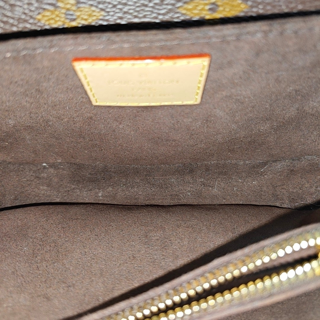 MÉTIS EAST WEST Monogram Coated Canvas Brown