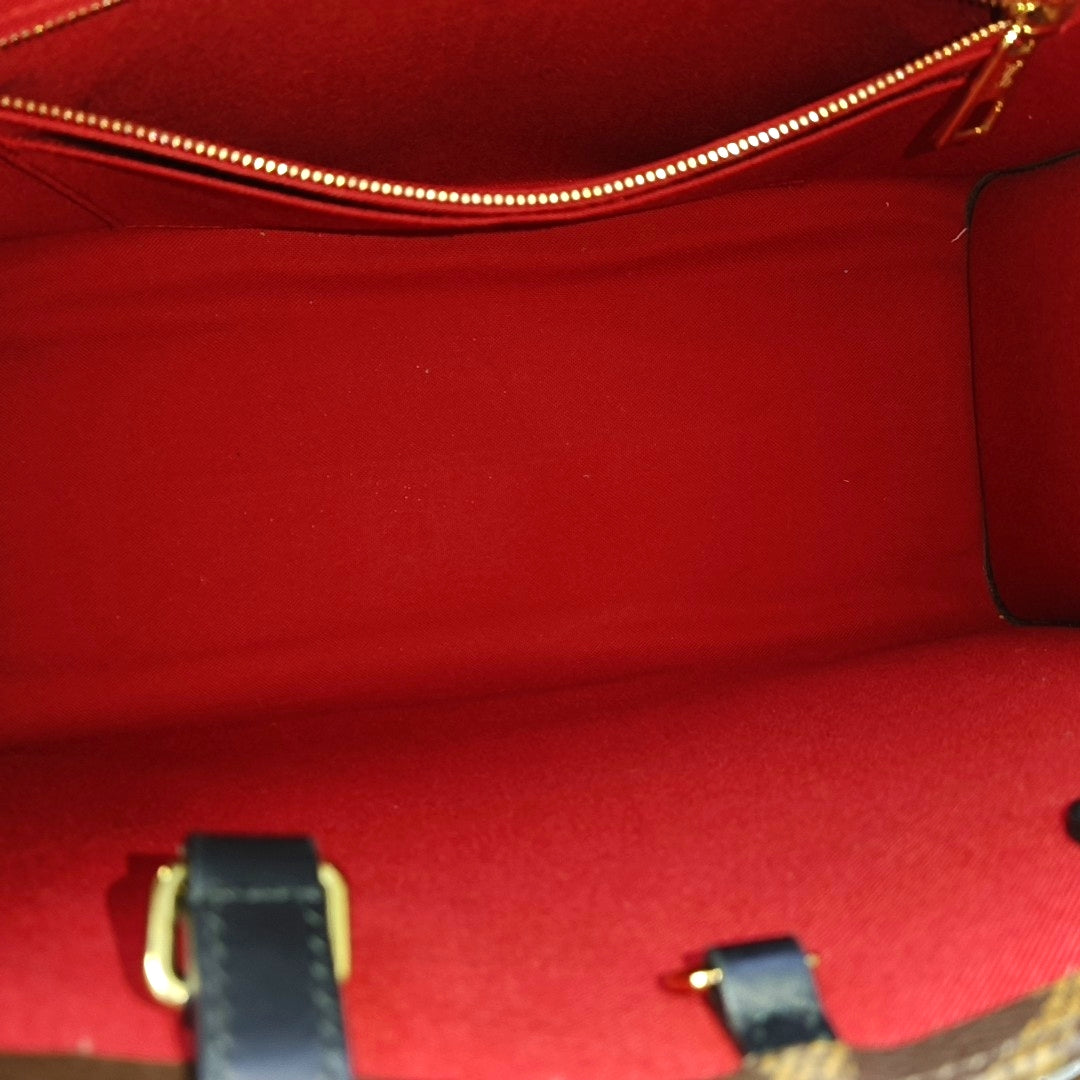 ONTHEGO MM Monogram Coated Canvas Brown