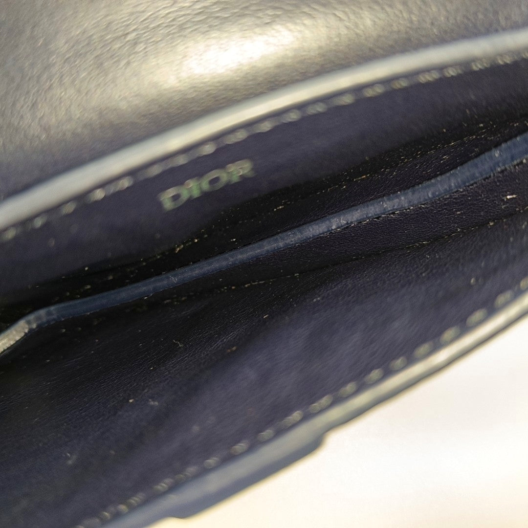 Authenticated pre-owned  Saddle Calfskin Blue - Clutch at Looply