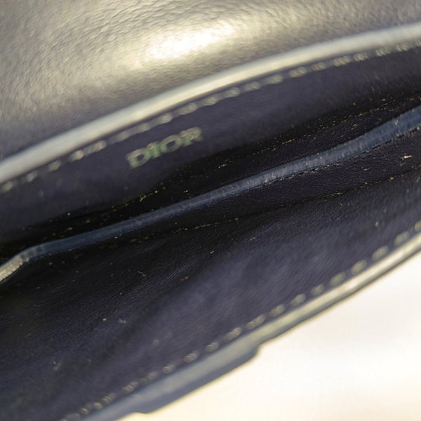 Authenticated pre-owned  Saddle Calfskin Blue - Clutch at Looply
