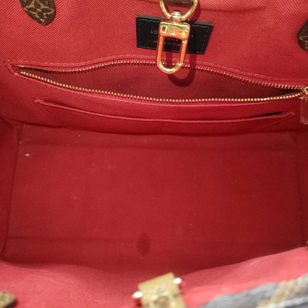 ONTHEGO MM Monogram Coated Canvas Brown