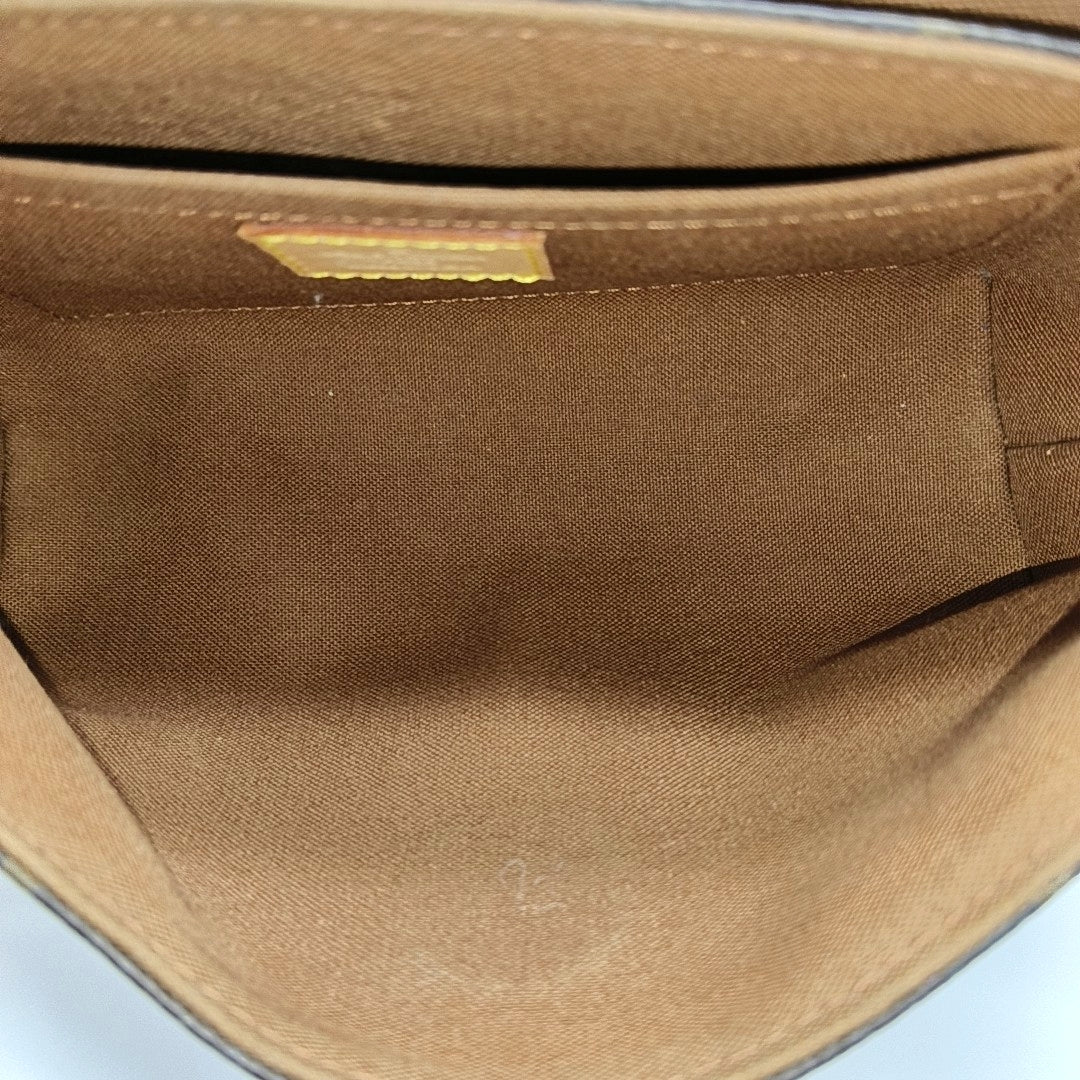 TIKAL Monogram Coated Canvas Brown