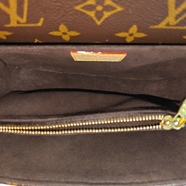 MÉTIS EAST WEST Monogram Coated Canvas Brown