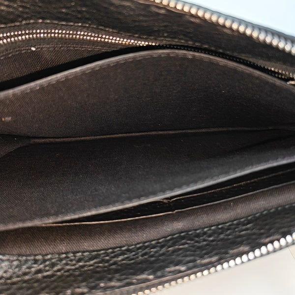 Authenticated pre-owned  Monster Calfskin Black - Clutch at Looply
