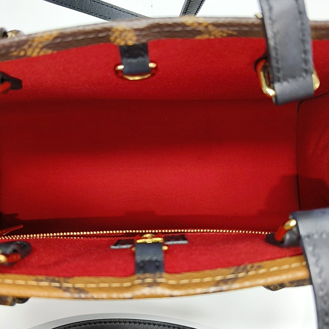ONTHEGO MM Monogram Coated Canvas Brown