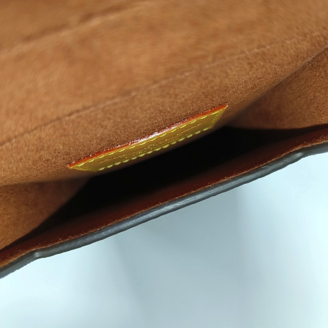 Monogram Coated Canvas Clutch Brown