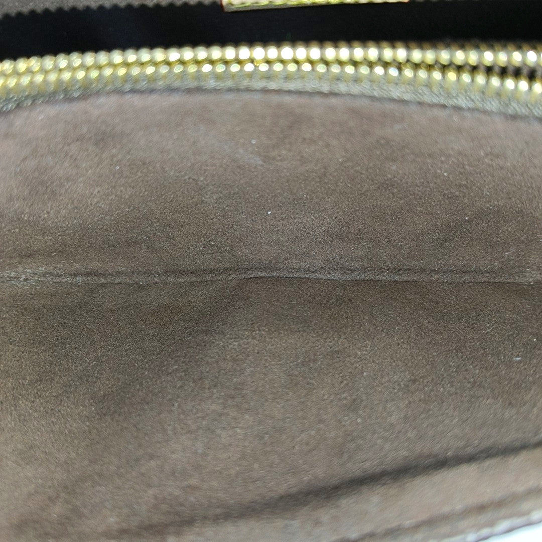 MÉTIS EAST WEST Monogram Coated Canvas Brown