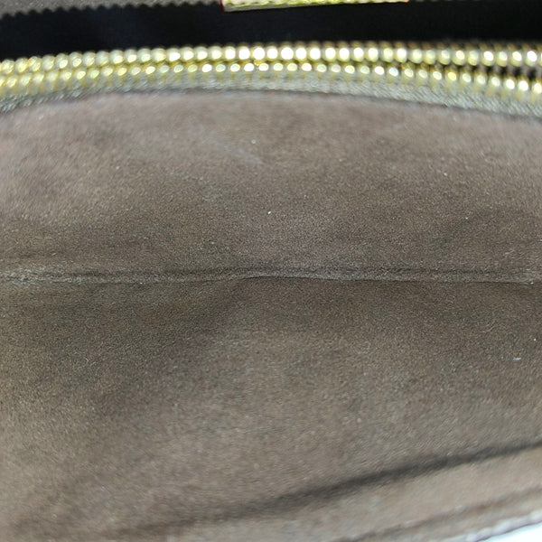 MÉTIS EAST WEST Monogram Coated Canvas Brown