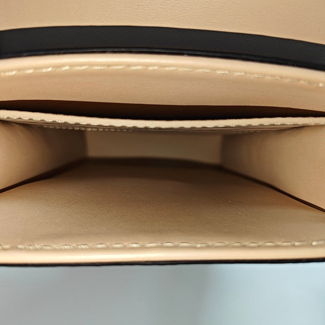 TRUNK Monogram Coated Canvas Brown