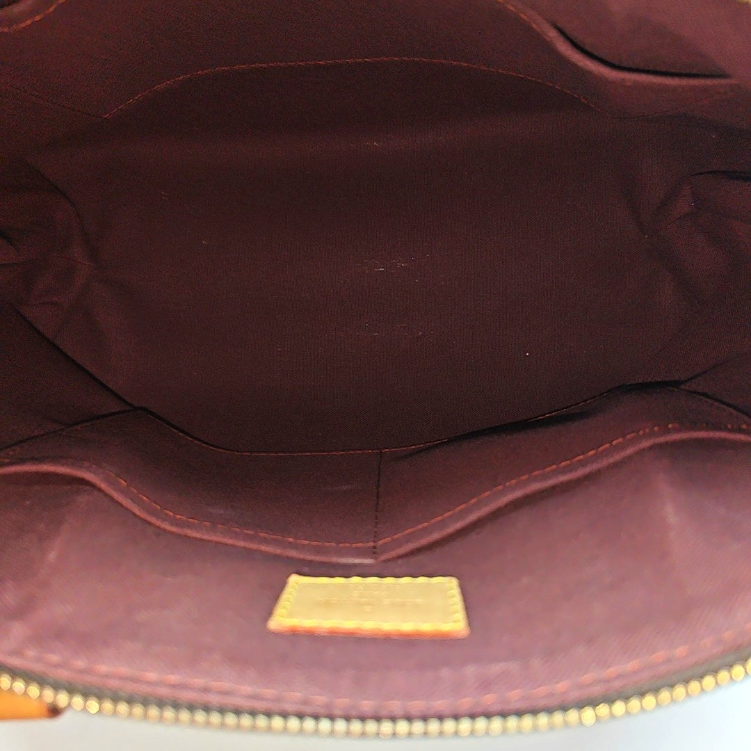 RIVOLI MM Monogram Coated Canvas Brown