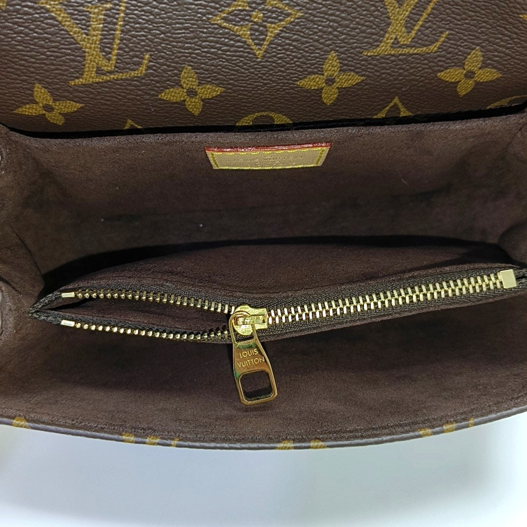 MÉTIS EAST WEST Monogram Coated Canvas Brown