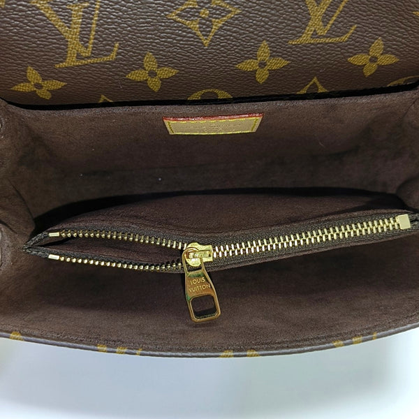 MÉTIS EAST WEST Monogram Coated Canvas Brown