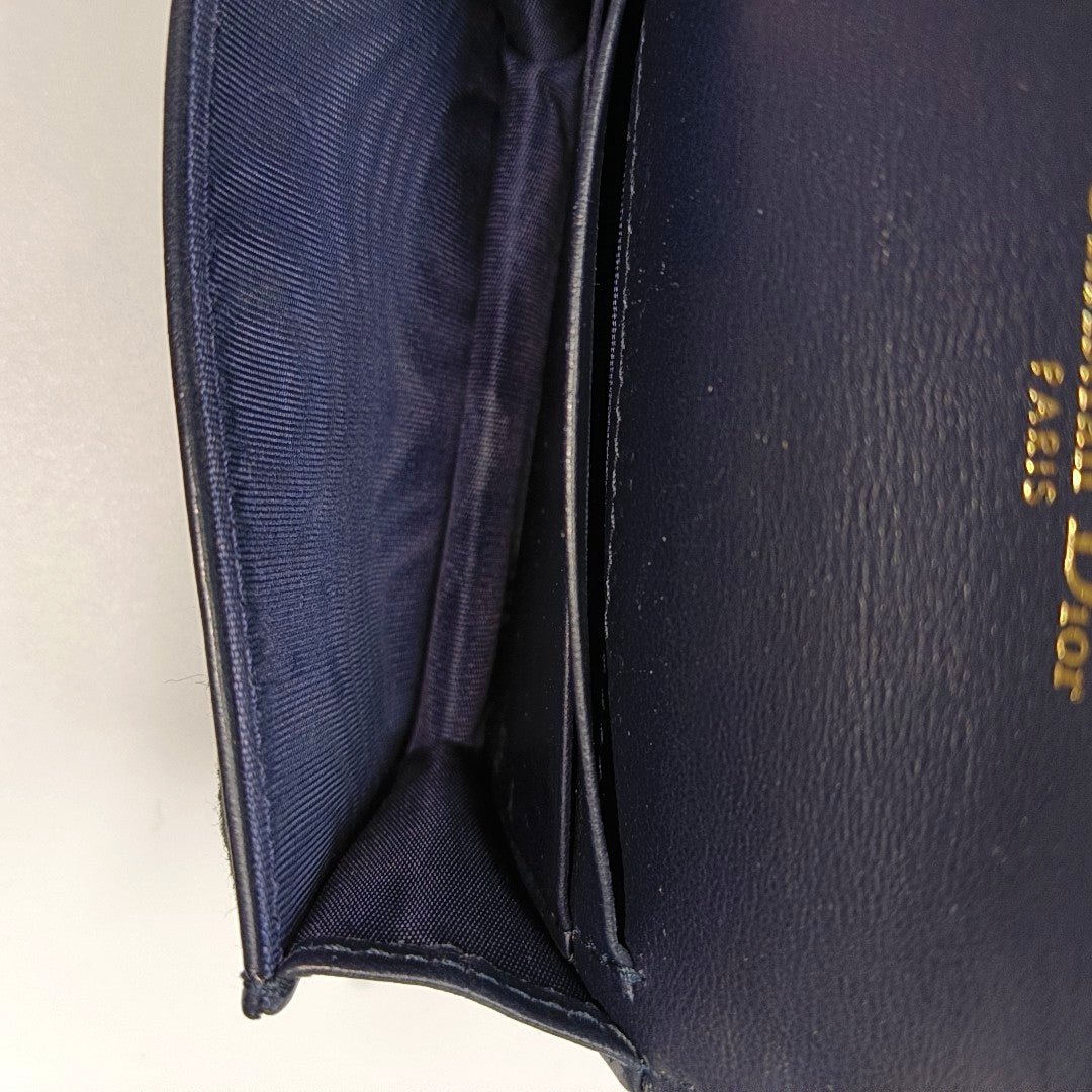 Authenticated pre-owned  Saddle Monogram Canvas Blue Card Holder - Card Holder at Looply