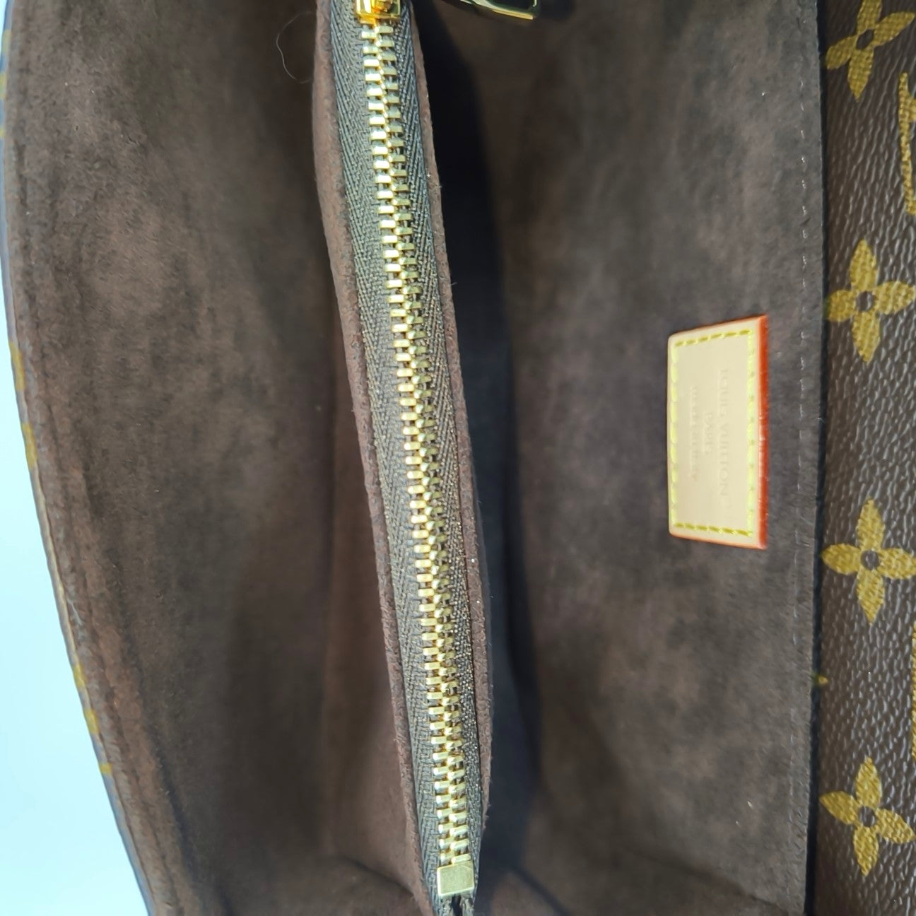 MÉTIS EAST WEST Monogram Coated Canvas Brown