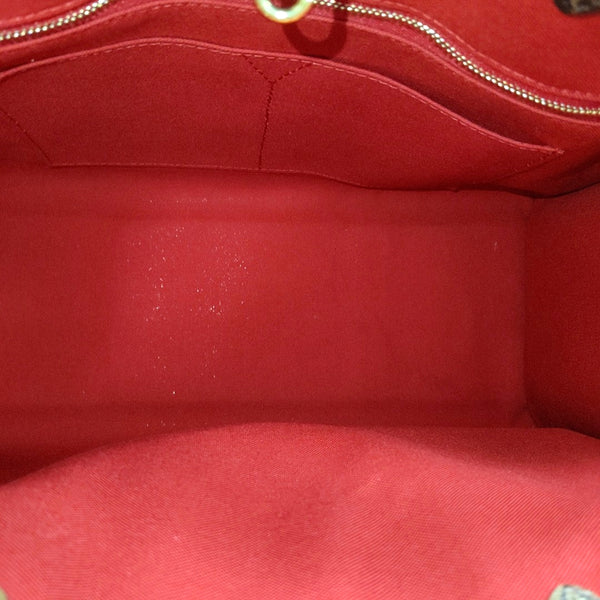 ONTHEGO MM Monogram Coated Canvas Brown