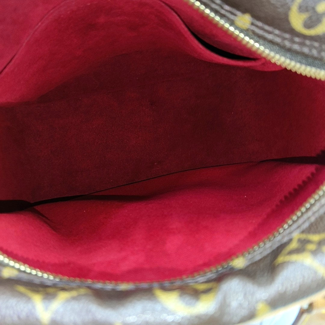 EXCENTRI-CITE Monogram Coated Canvas Brown