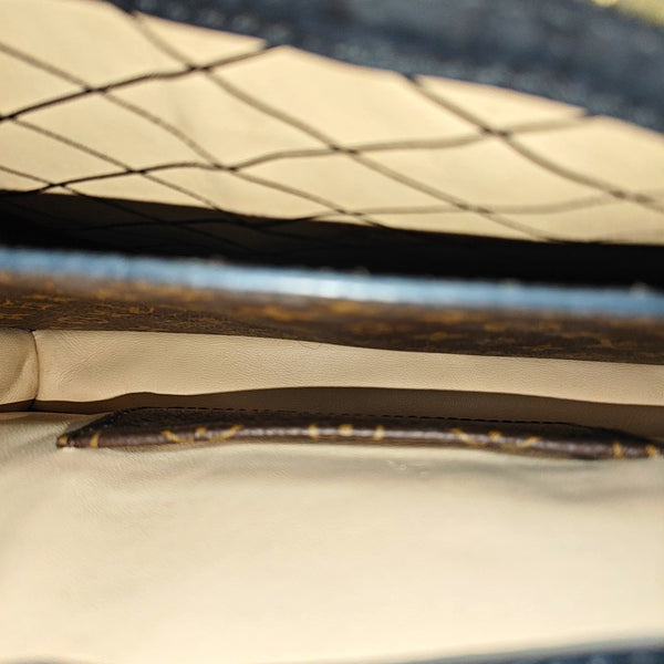 TRUNK Monogram Coated Canvas Brown