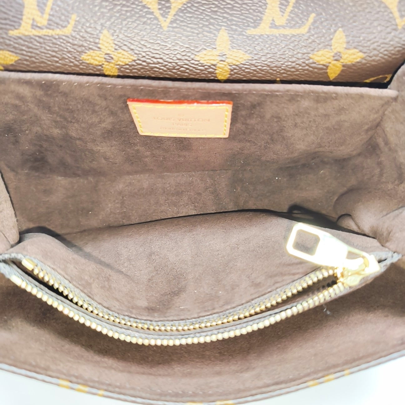 MÉTIS EAST WEST Monogram Coated Canvas Brown