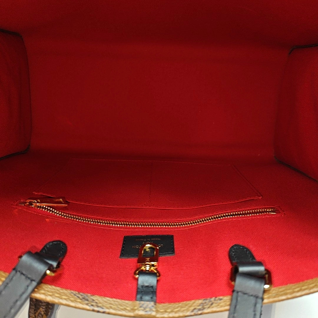 ONTHEGO MM Monogram Coated Canvas Brown