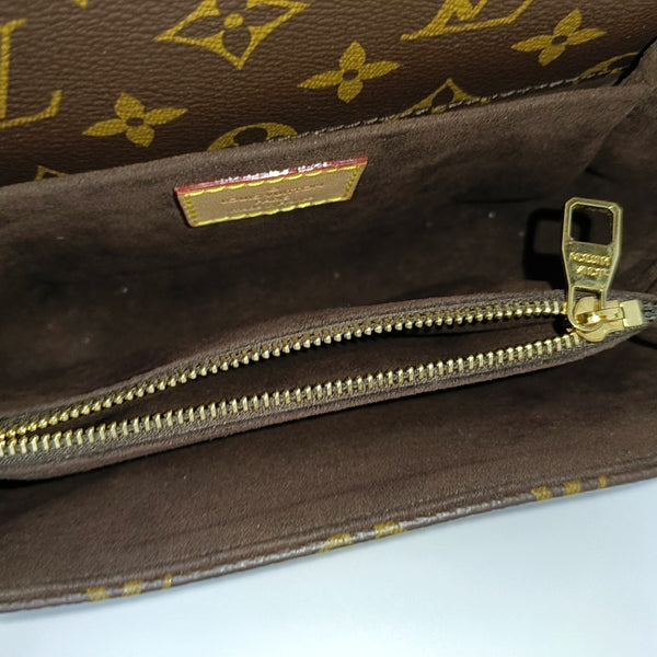MÉTIS EAST WEST Monogram Coated Canvas Brown
