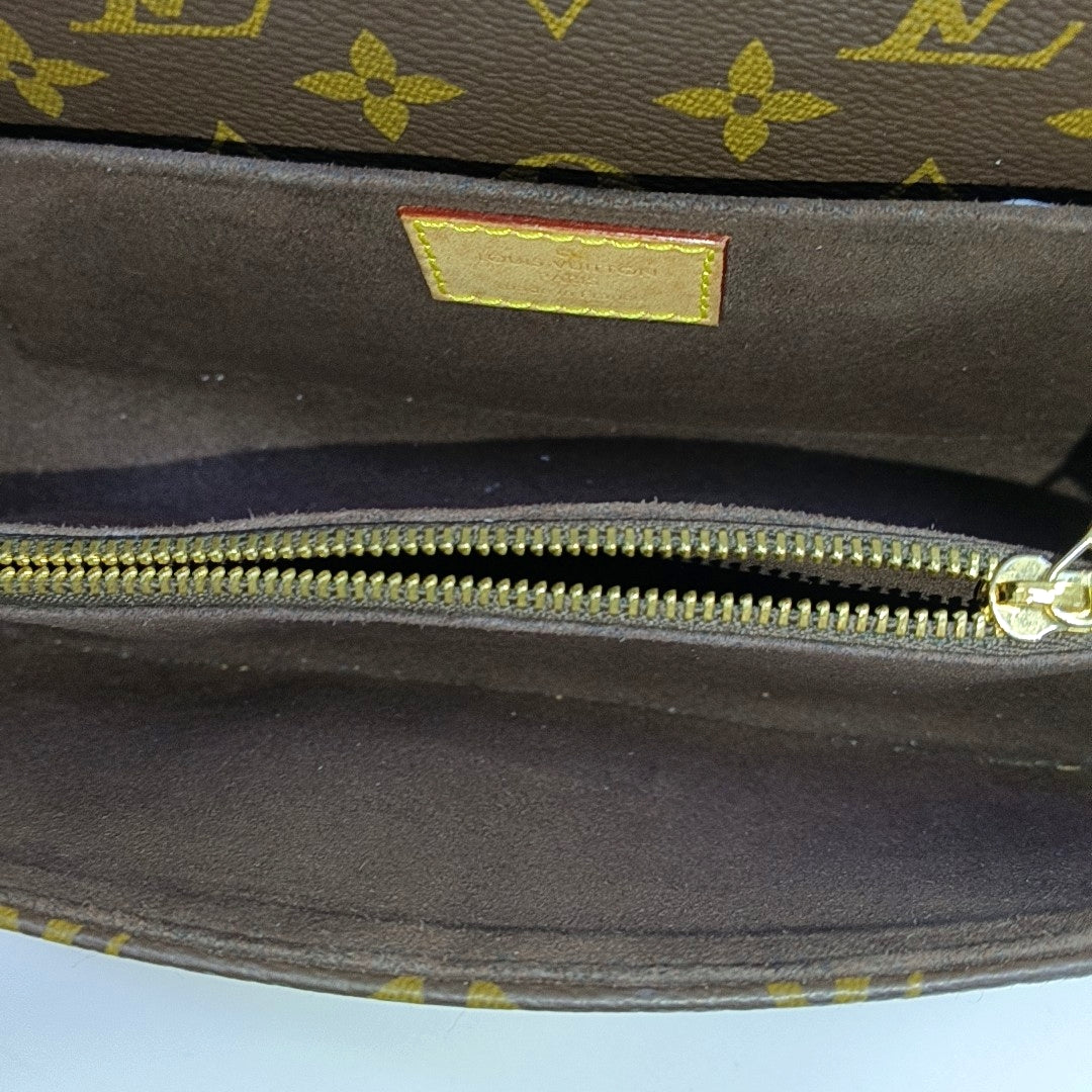 MÉTIS EAST WEST Monogram Coated Canvas Brown