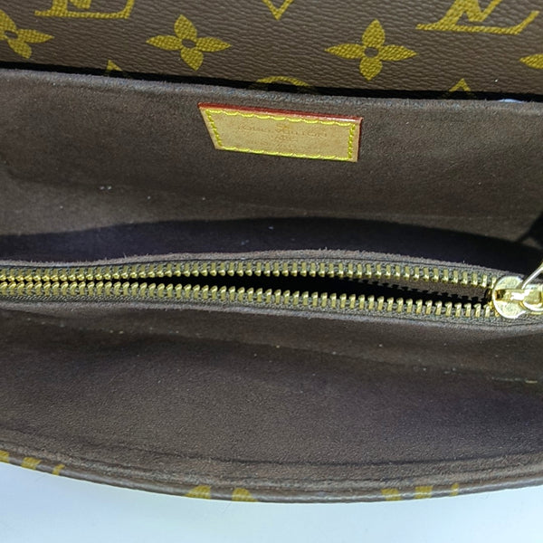 MÉTIS EAST WEST Monogram Coated Canvas Brown