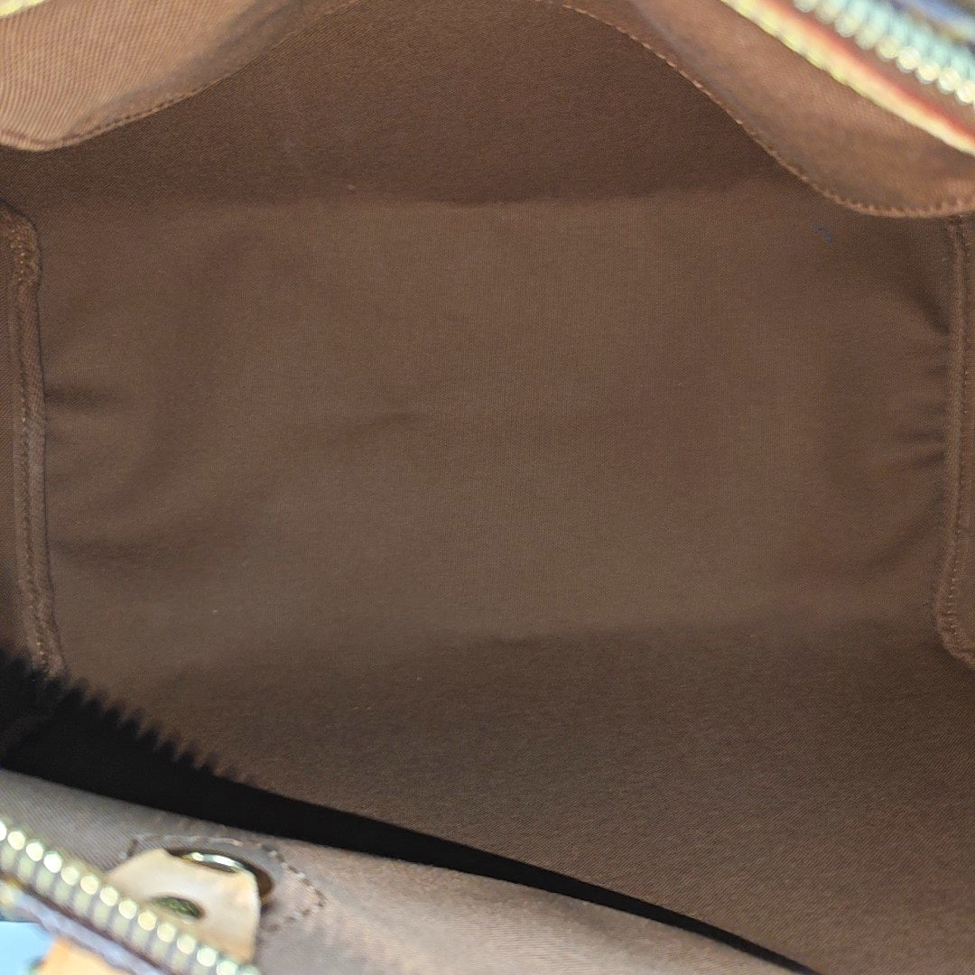 Authenticated pre-owned  SPEEDY 35 Monogram Coated Canvas Brown - Top Handle Bag at Looply