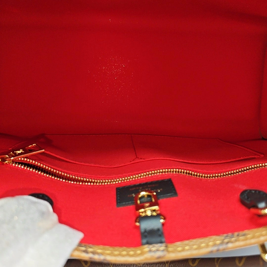 ONTHEGO MM Monogram Coated Canvas Brown