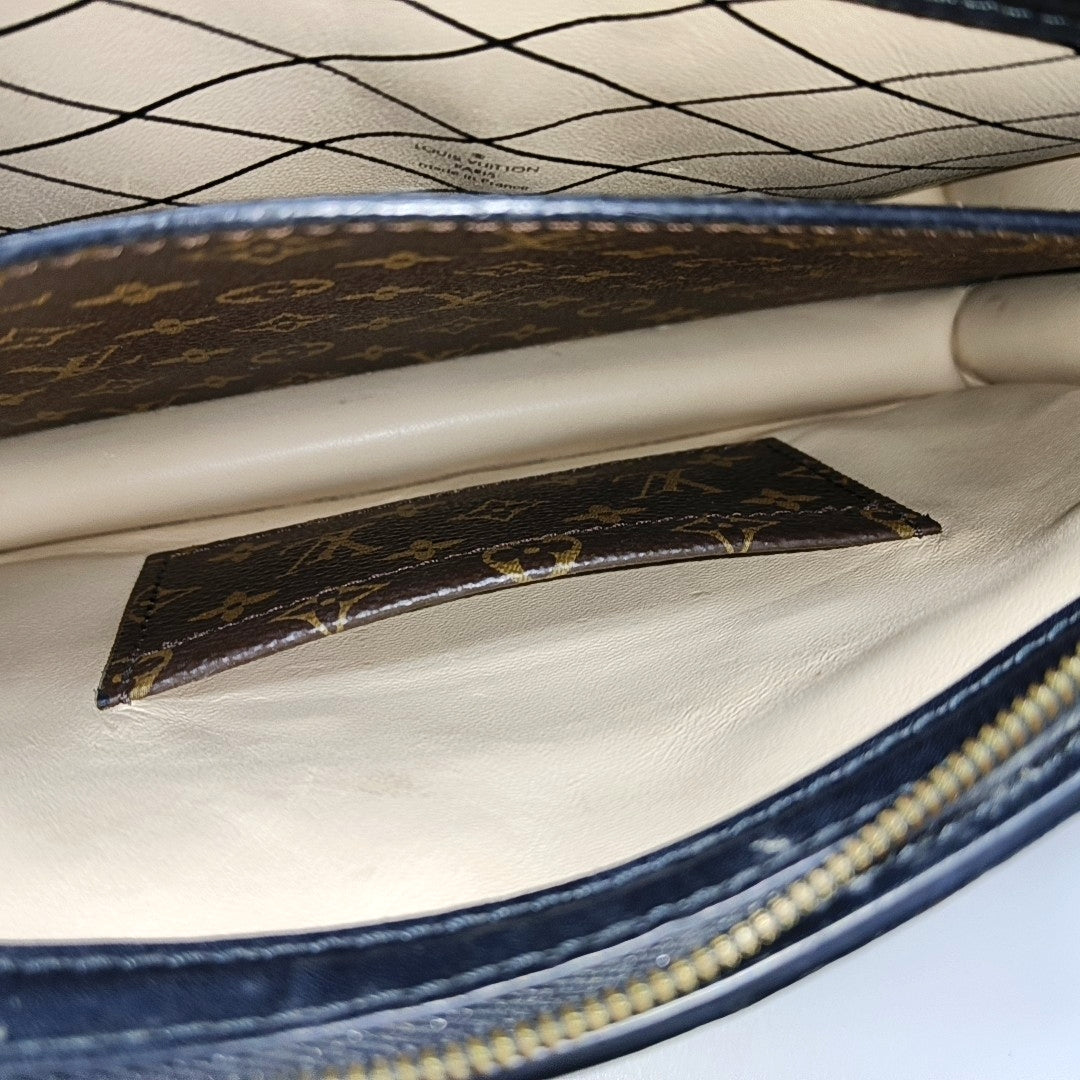 TRUNK Monogram Coated Canvas Brown