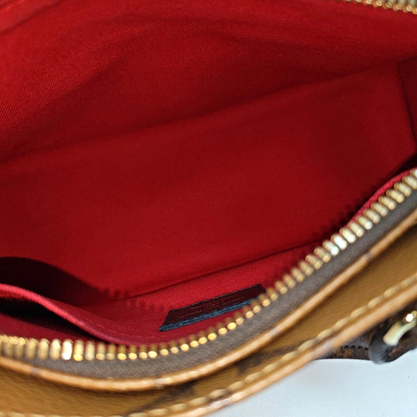 ONTHEGO EAST WEST PM Monogram Coated Canvas Brown