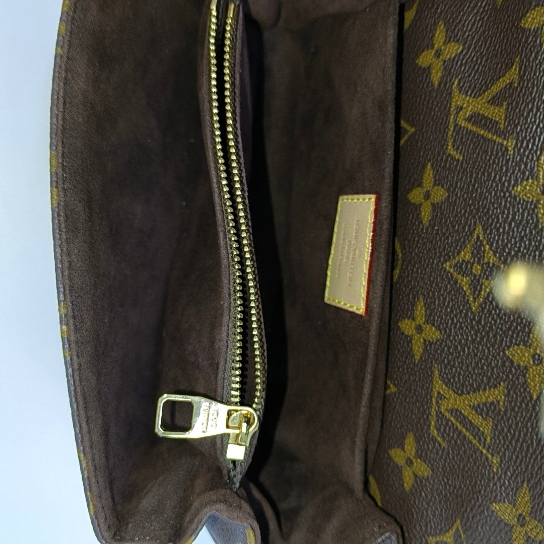 MÉTIS EAST WEST Monogram Coated Canvas Brown
