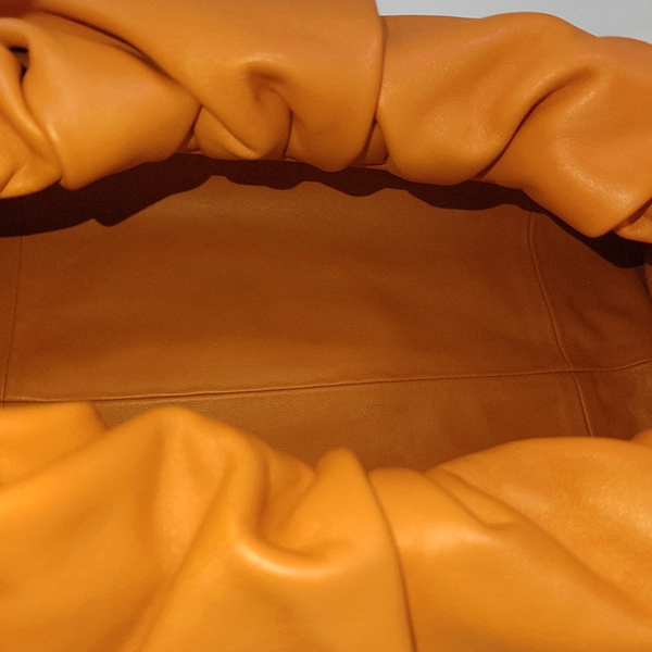 Authenticated pre-owned  The Pouch Calfskin Orange - Top Handle Bag at Looply
