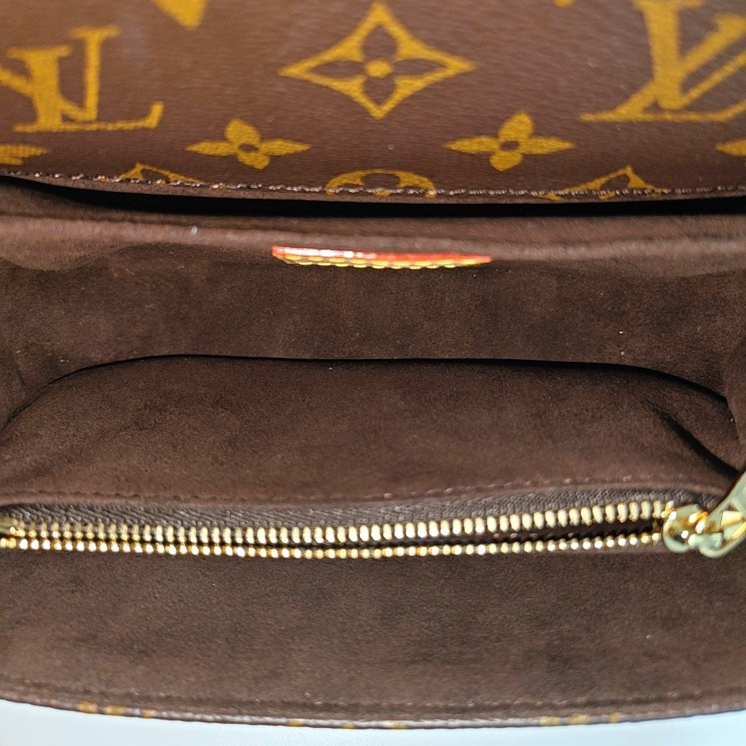 MÉTIS EAST WEST Monogram Coated Canvas Brown