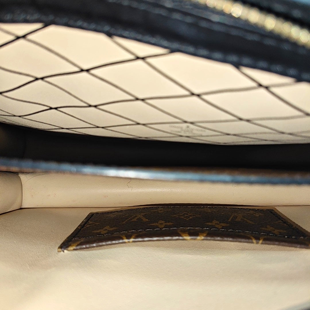 TRUNK Monogram Coated Canvas Brown