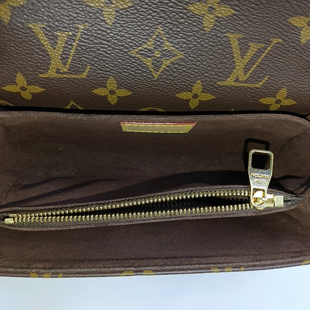 MÉTIS EAST WEST Monogram Coated Canvas Brown
