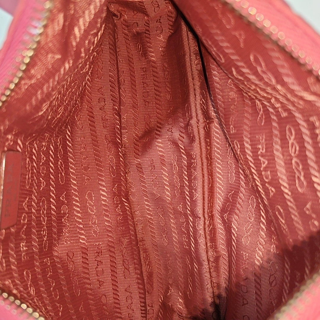 Authenticated pre-owned  Re-Edition2005 Mini Nylon Red - Top Handle Bag at Looply