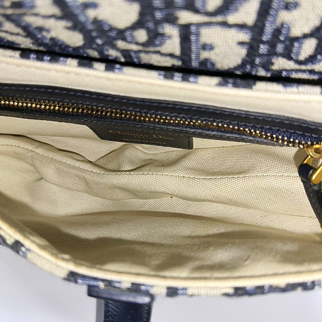 Authenticated pre-owned  Saddle Medium Oblique Canvas Blue - Top Handle Bag at Looply