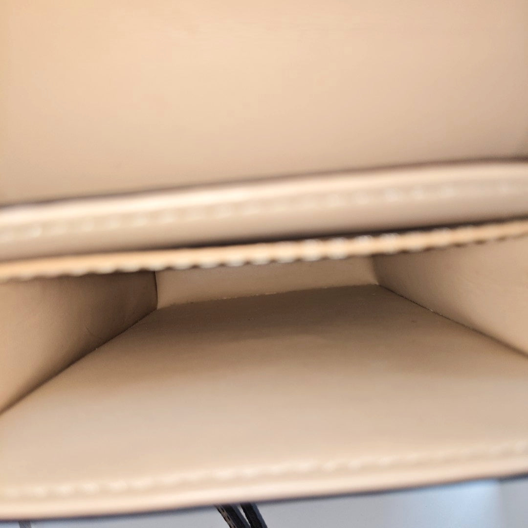 TRUNK Monogram Coated Canvas Brown