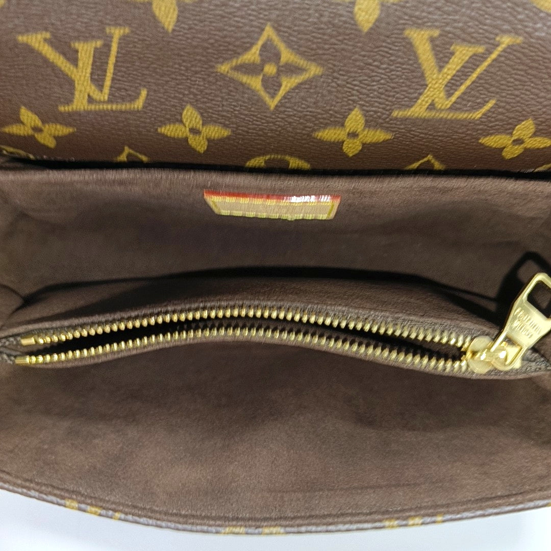 MÉTIS EAST WEST Monogram Coated Canvas Brown