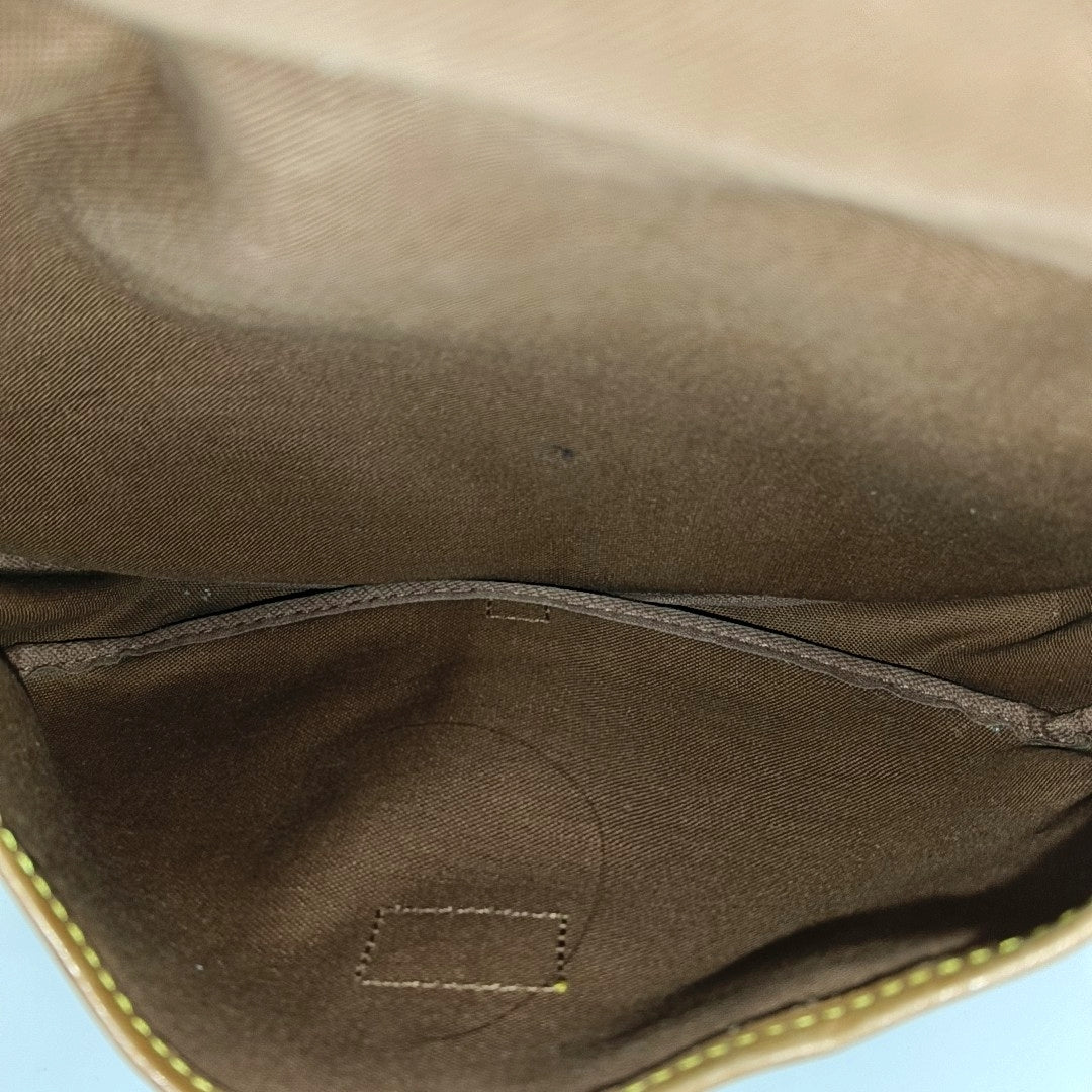 SAUMUR Monogram Coated Canvas Brown