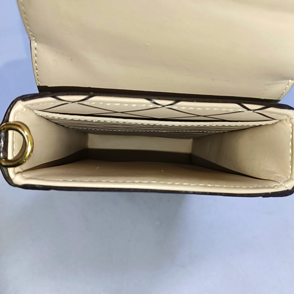 TRUNK Monogram Coated Canvas Brown