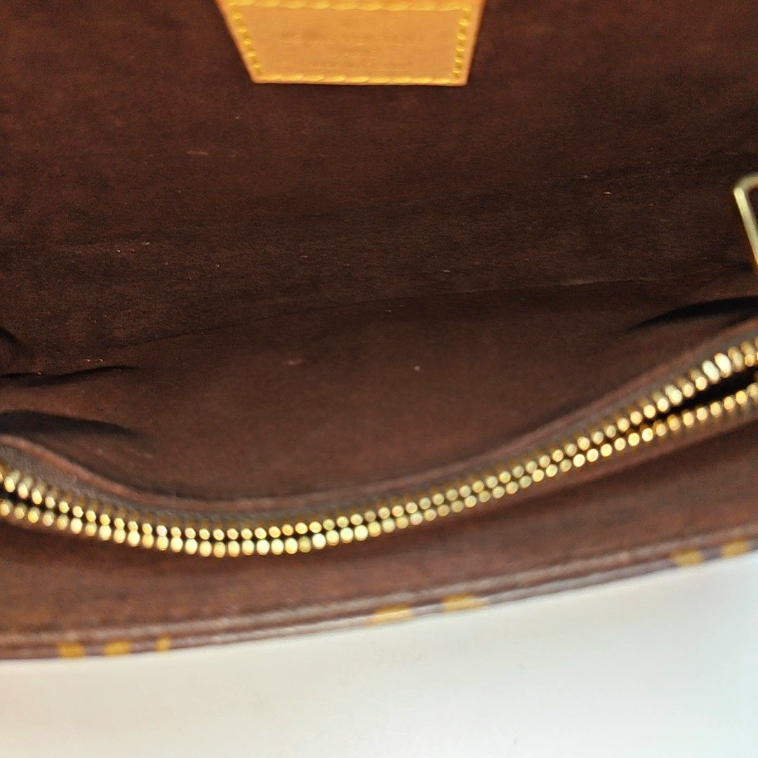 MÉTIS EAST WEST Monogram Coated Canvas Brown