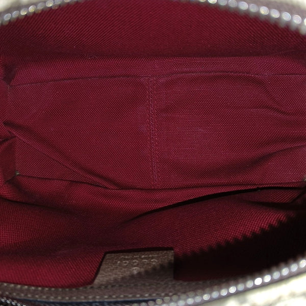 Trunk Monogram Coated Canvas Brown