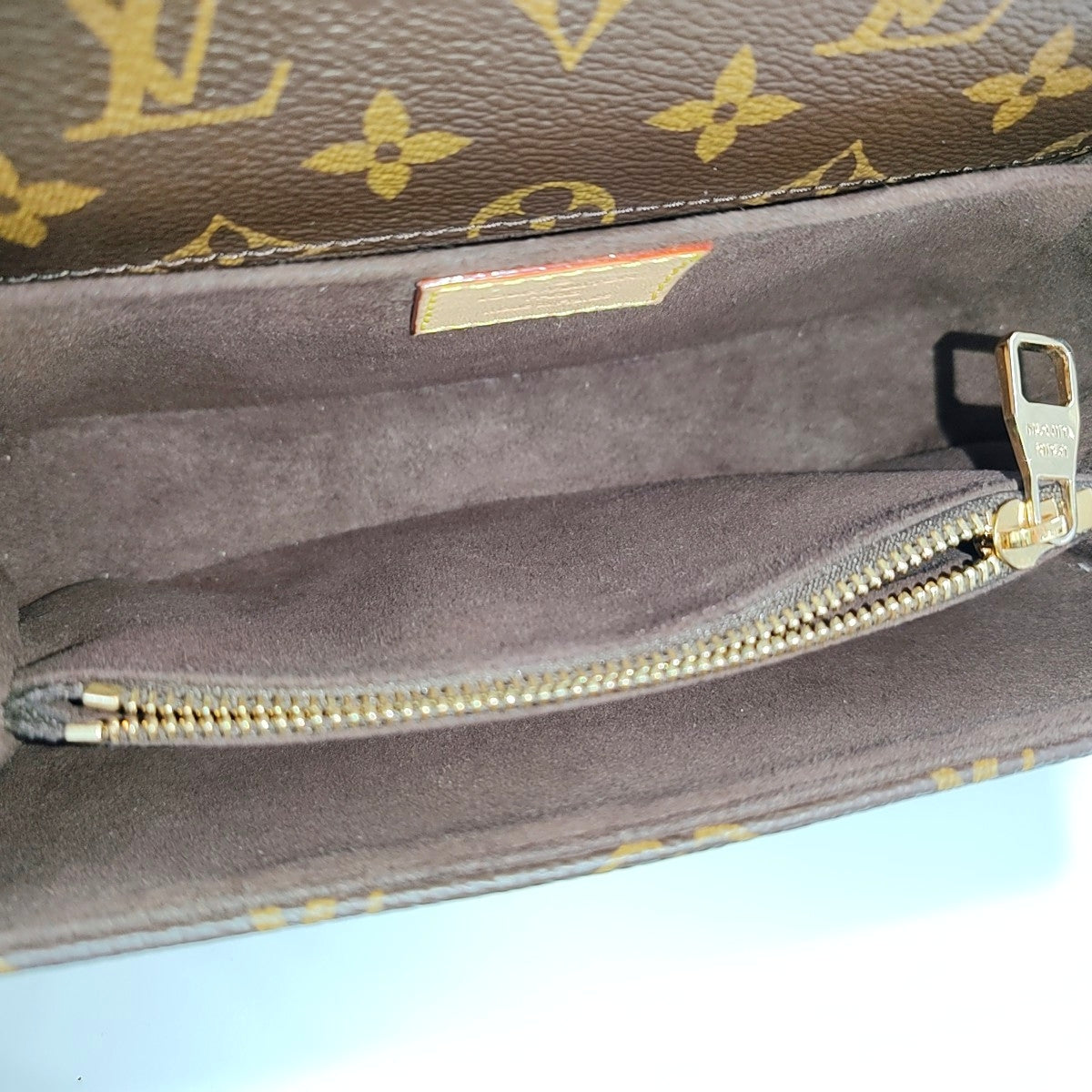 MÉTIS EAST WEST Monogram Coated Canvas Brown