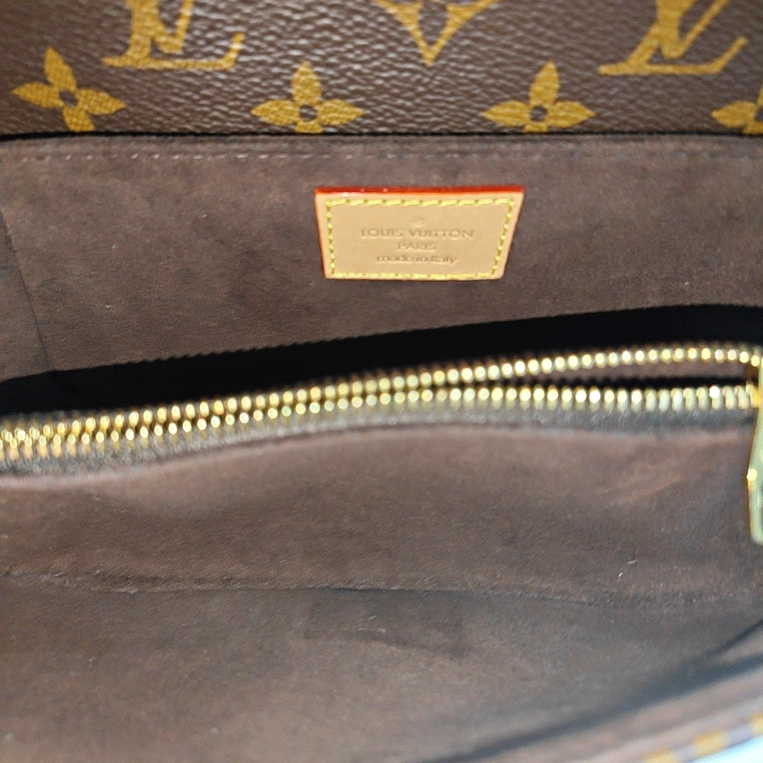 MÉTIS EAST WEST Monogram Coated Canvas Brown